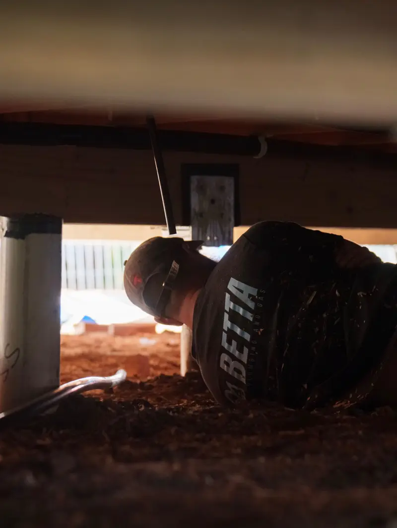In the crawl space — pipe runs going in