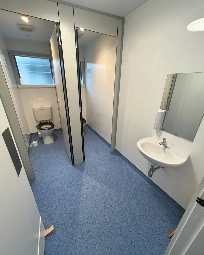 Commercial washroom fit-out — cubicle detail